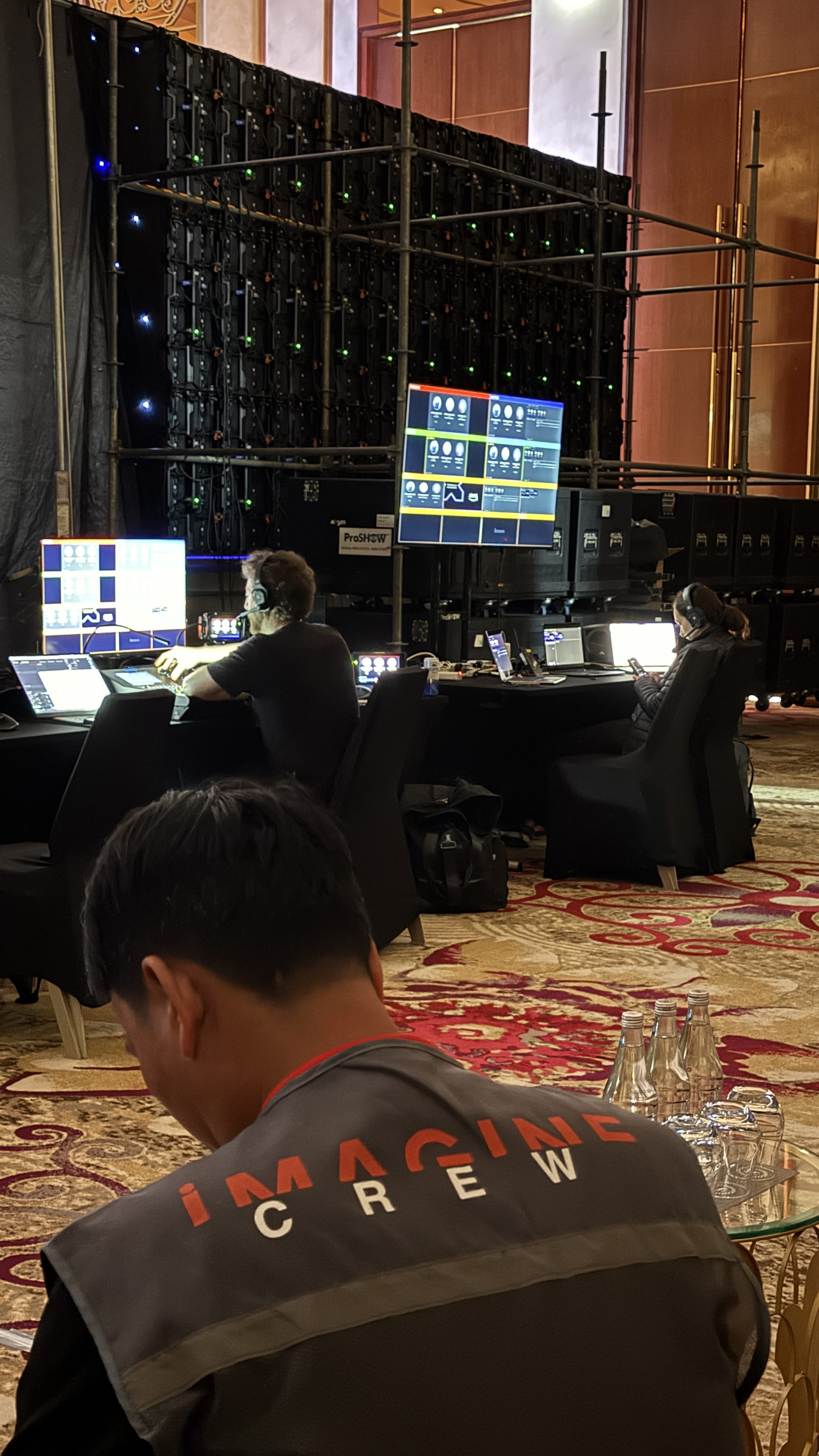 Flown line-array cabinet close-up during rig build