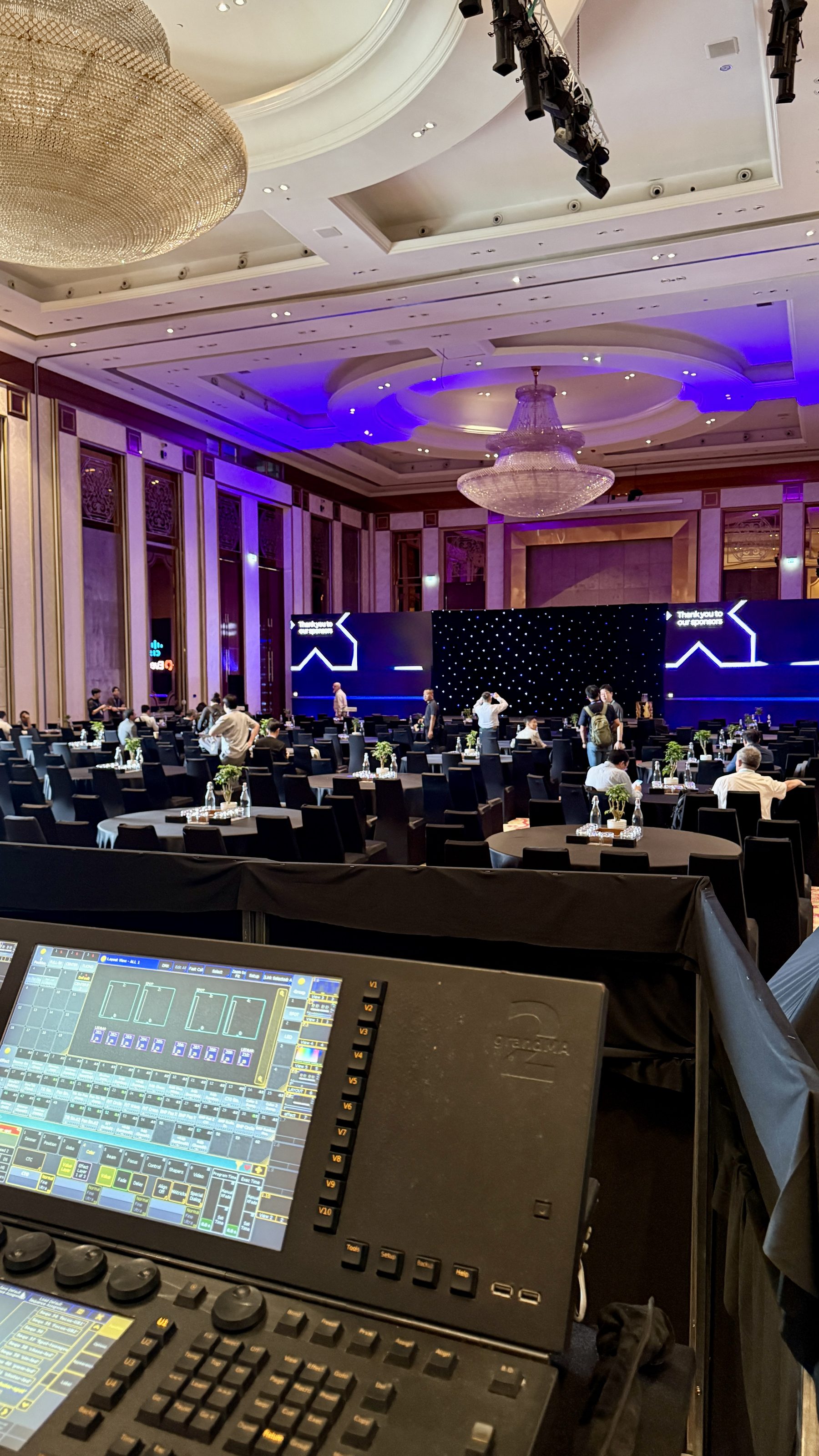 Crew at the lighting and vision production desks during build