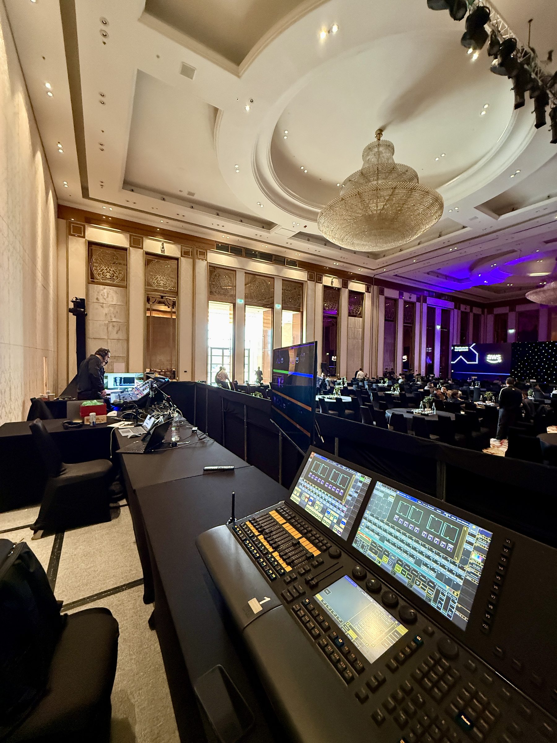 Crew at the FOH production desks with multiple monitors