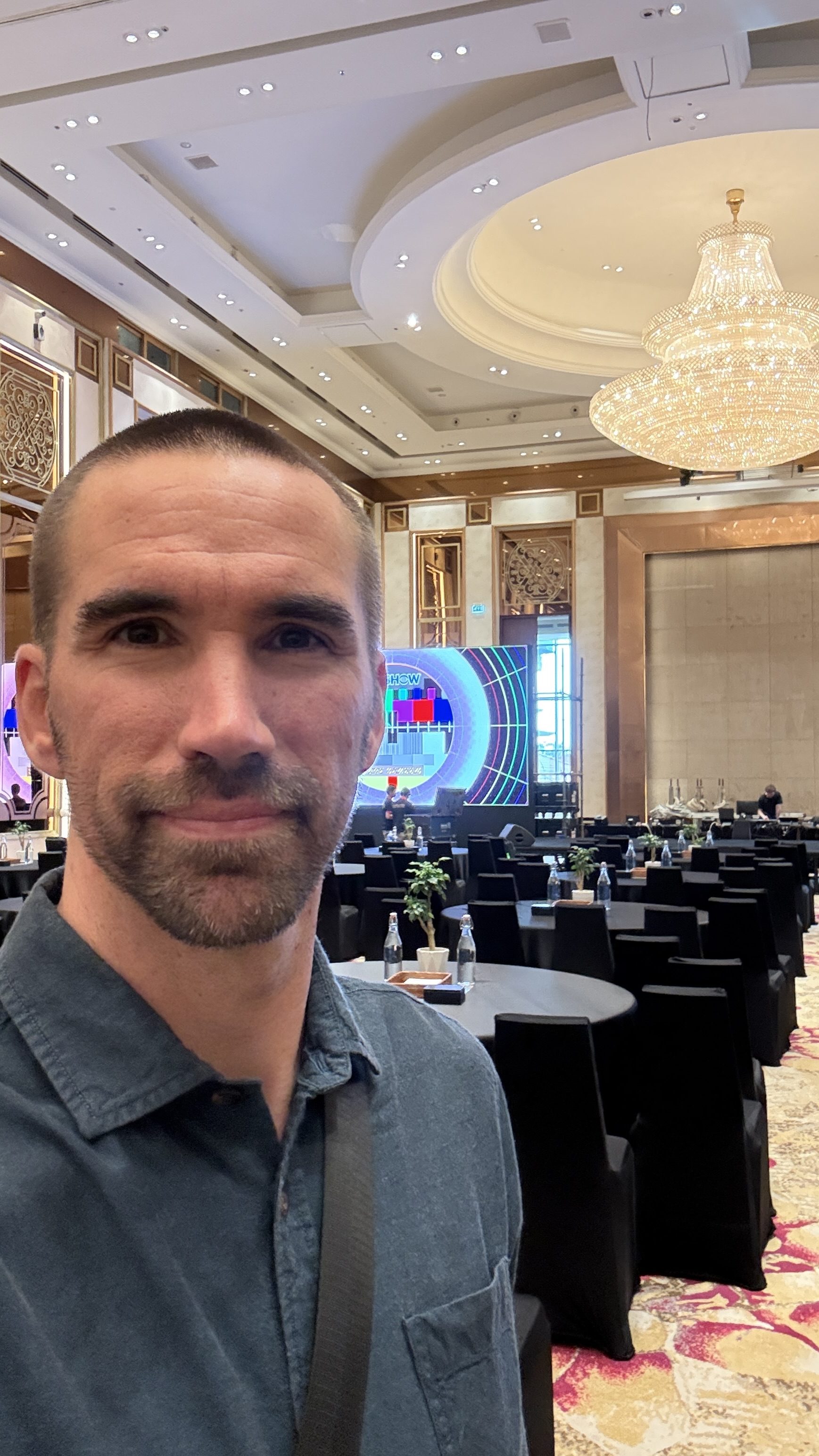 Jorn on site at the Global Tech Summit ballroom, LED wall behind him