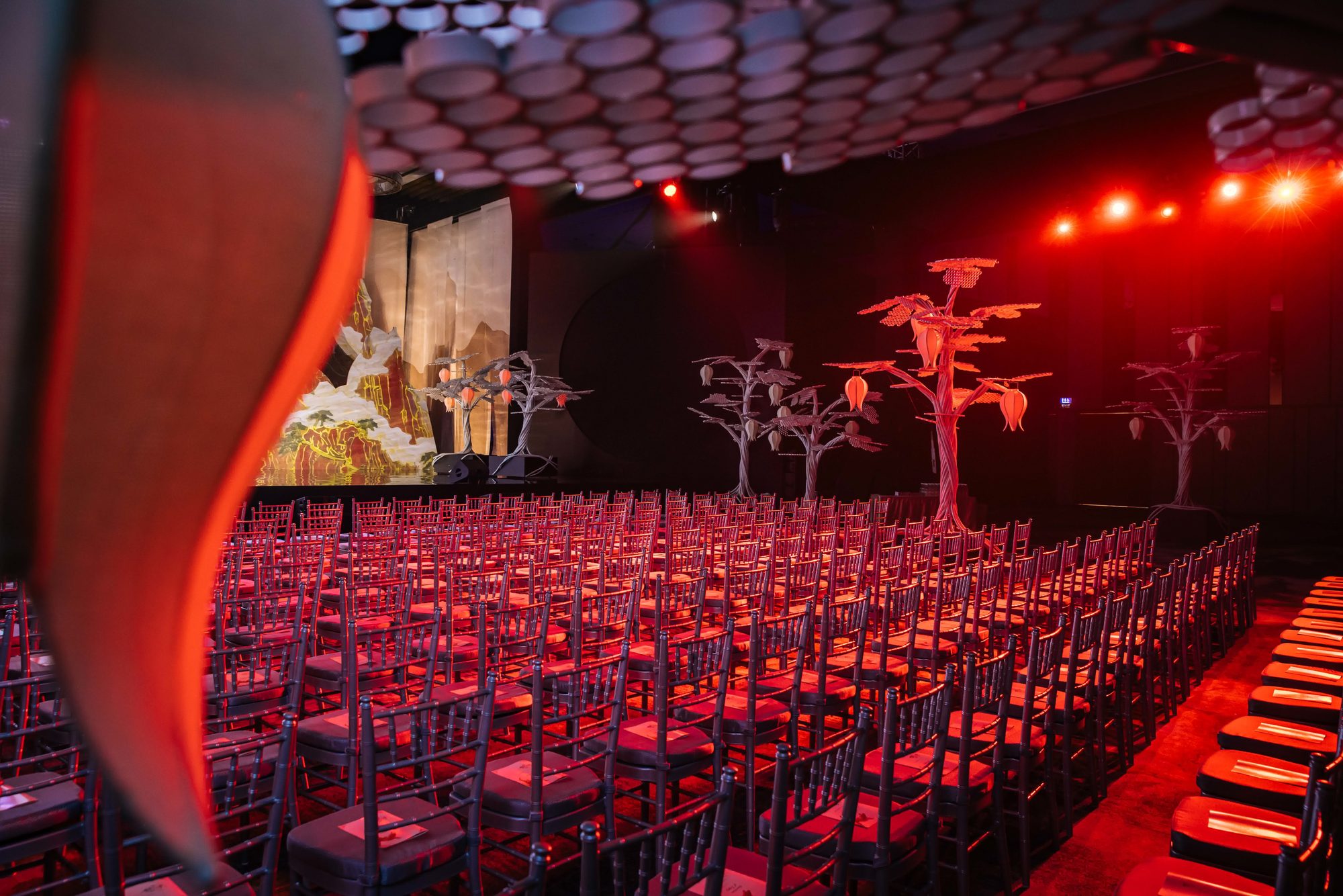 HSBC plenary auditorium dressed in red with sculpted trees