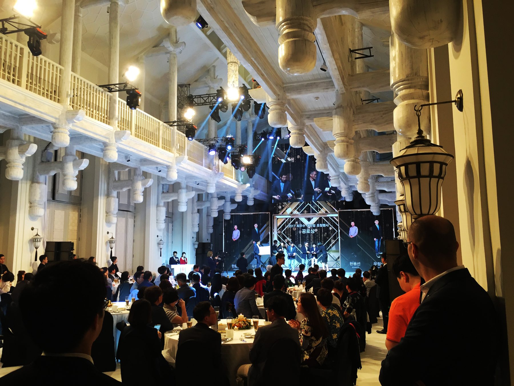 SK Telecom gala in a white classical hall with the stage lit