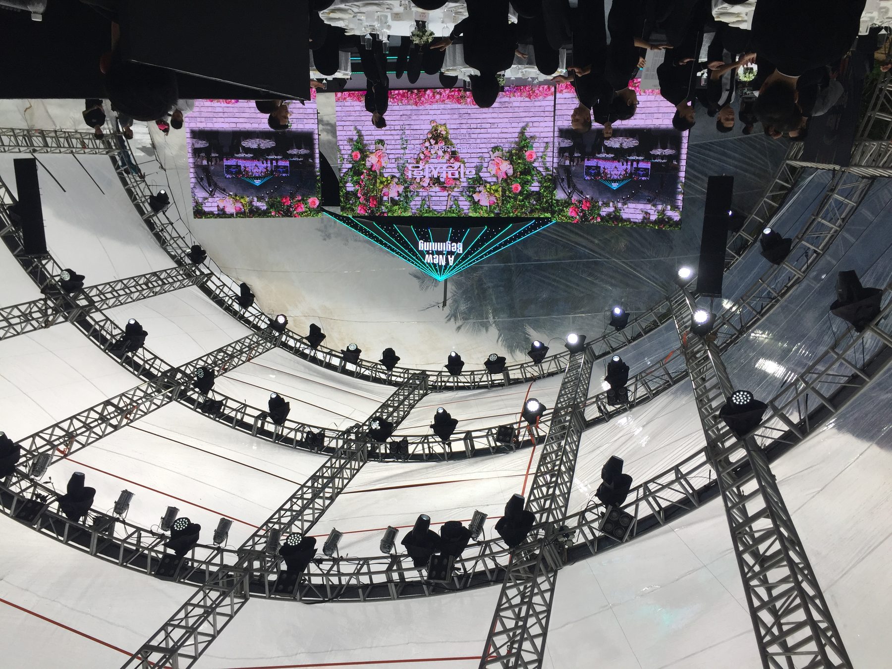 Red and green LED graphic wall with side screens during the awards segment