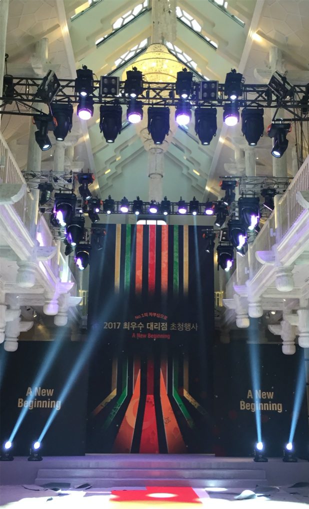 Overhead view of the circular truss rig with the audience below