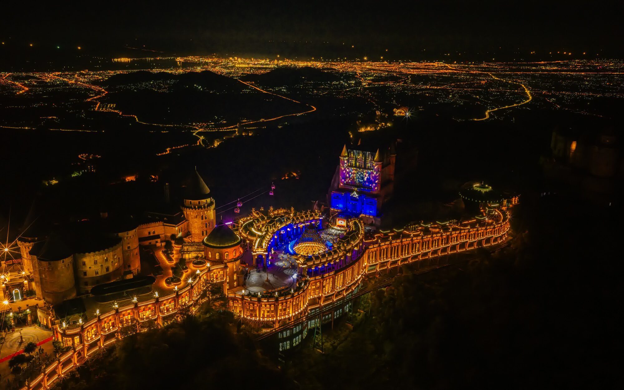 Aerial view of the Da Nang coastline and city skyline at dusk